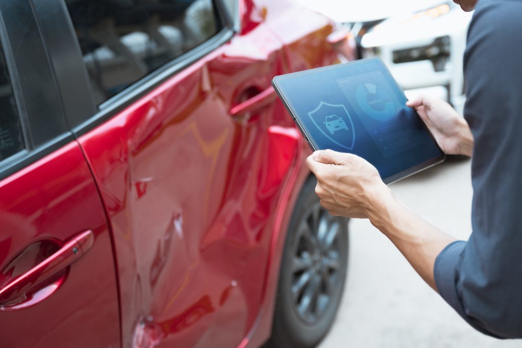 A red car is bumped and need insurance.